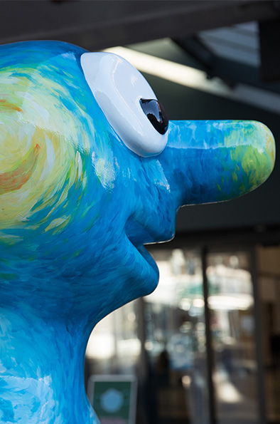 Close-up of Morph statue head, painted in the Van Gogh impressionist yellow and blue style 